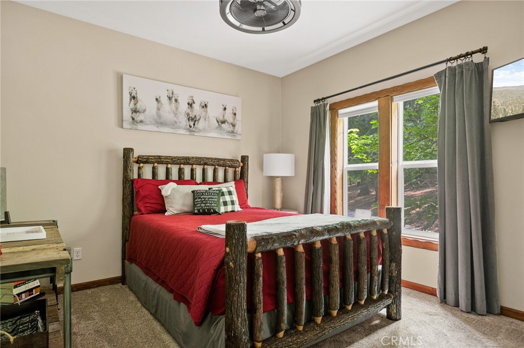 523 Dogwood Canyon Road Blue Jay, CA 92317 - Photo 18 of 33 a bedroom with a bed and a window