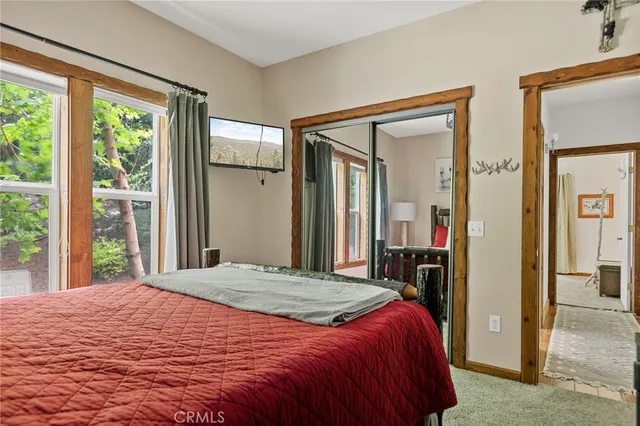 a bathroom with a granite countertop sink a mirror and a bathtub