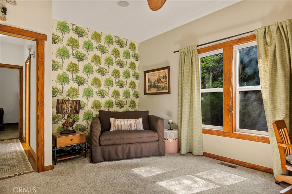 523 Dogwood Canyon Road Blue Jay, CA 92317 - Photo 22 of 33 a bedroom with a bed and a window