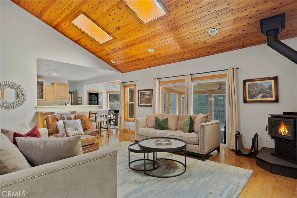 523 Dogwood Canyon Road Blue Jay, CA 92317 - Photo 5 of 33 a living room with furniture a rug and a flat screen tv