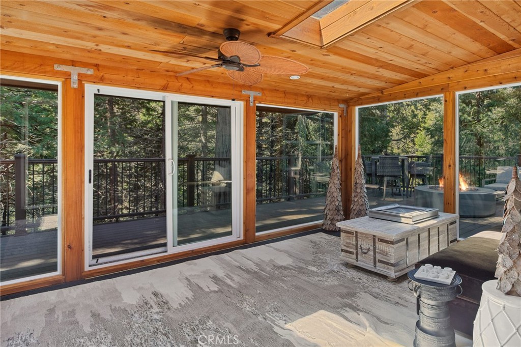 523 Dogwood Canyon Road Blue Jay, CA 92317 - Photo 8 of 33 a living room with furniture and large windows