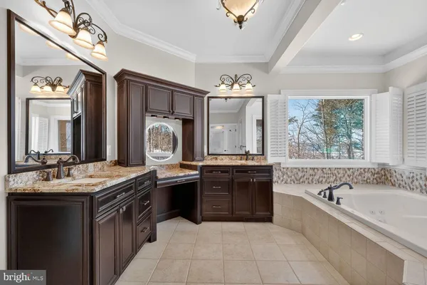 a kitchen with granite countertop a stove and a sink