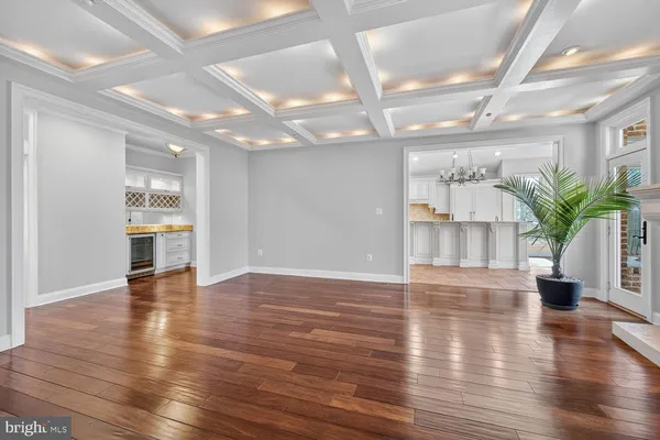 a large white kitchen with a sink and cabinets
