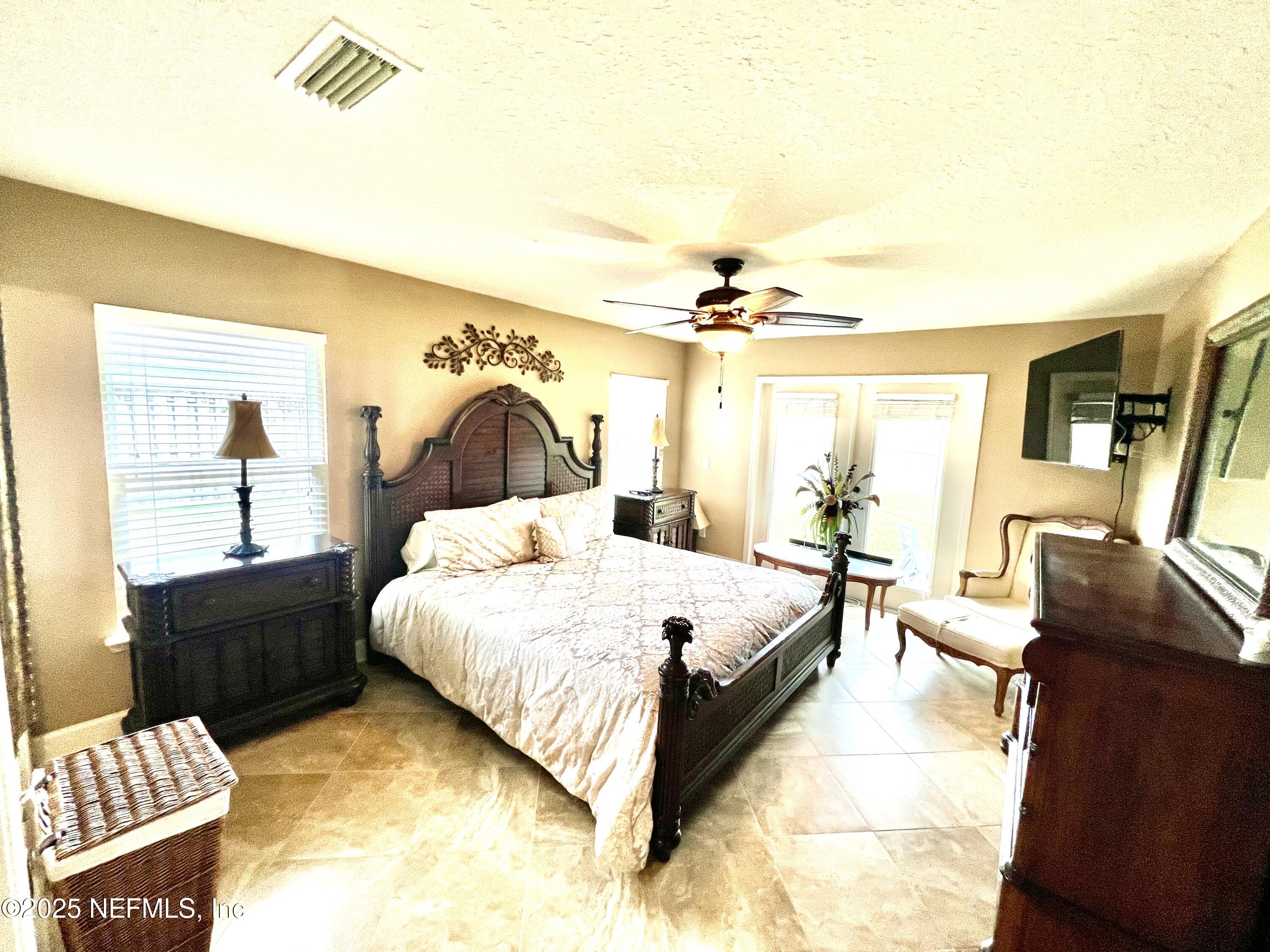 1024 Ardmore Street St. Augustine, FL 32092 - Photo 15 of 25 a spacious bedroom with a bed and wooden floor