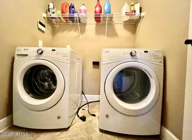 a utility room with dryer and washer