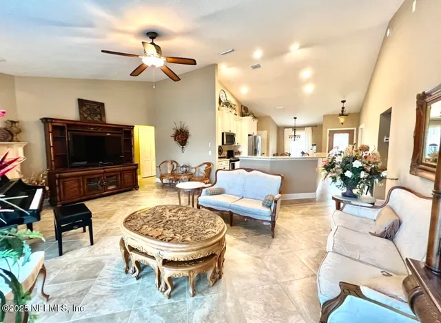 a living room with furniture and a flat screen tv