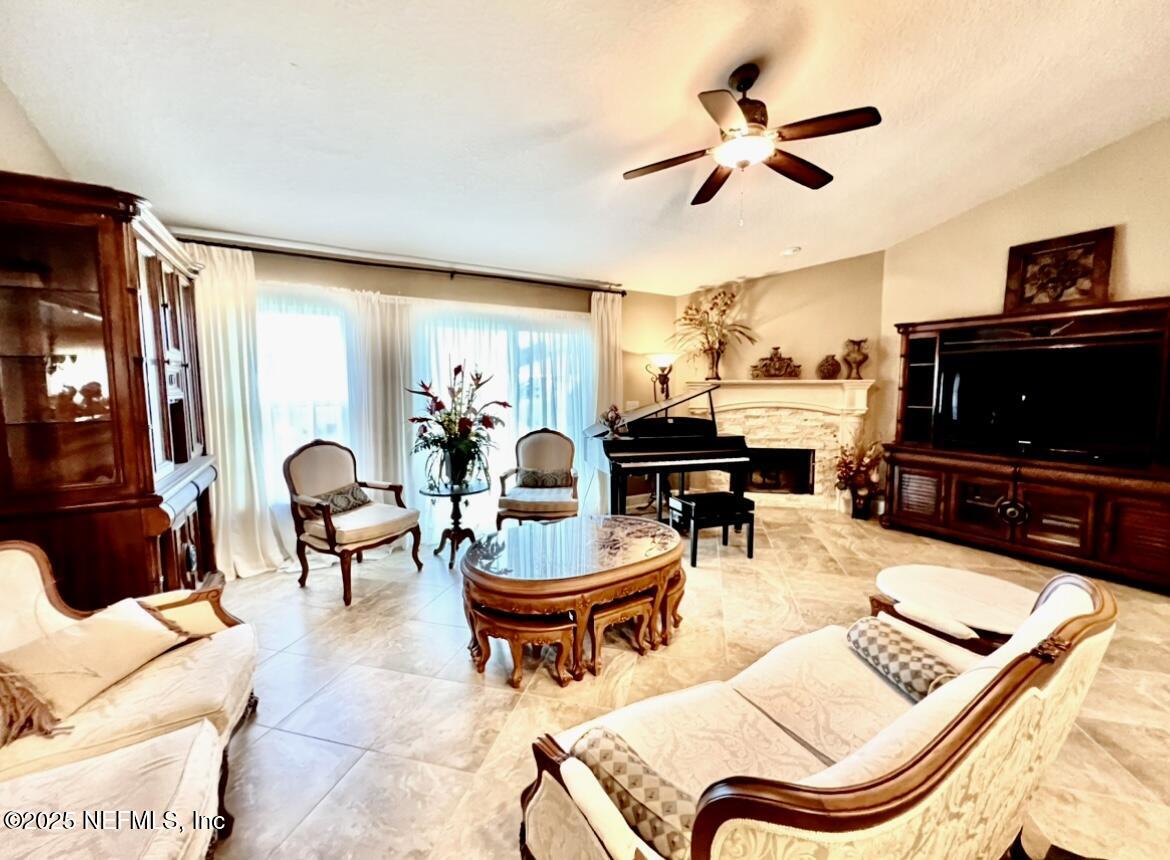 1024 Ardmore Street St. Augustine, FL 32092 - Photo 6 of 25 a living room with furniture and a flat screen tv