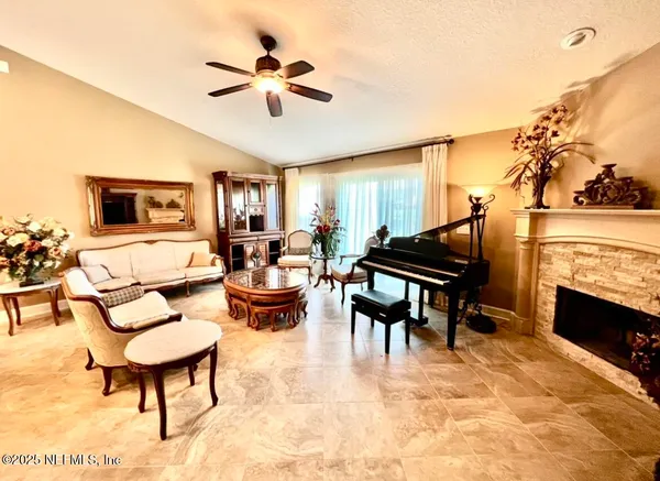 a living room with furniture and a fireplace