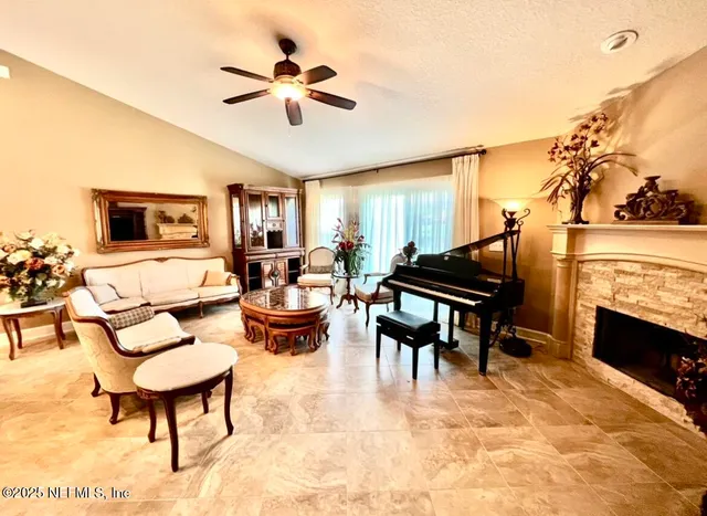 a living room with furniture and a fireplace