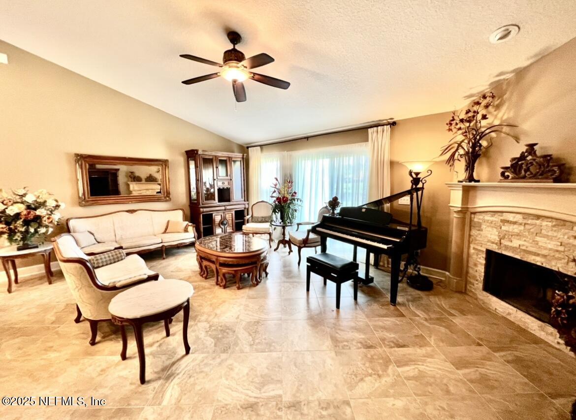 1024 Ardmore Street St. Augustine, FL 32092 - Photo 7 of 25 a living room with furniture and a fireplace