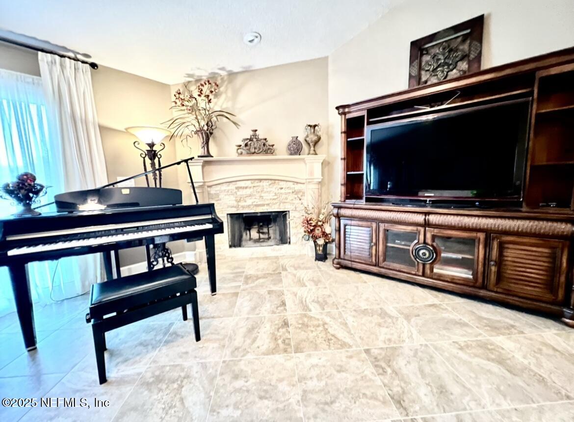 1024 Ardmore Street St. Augustine, FL 32092 - Photo 8 of 25 a living room with furniture and a flat screen tv
