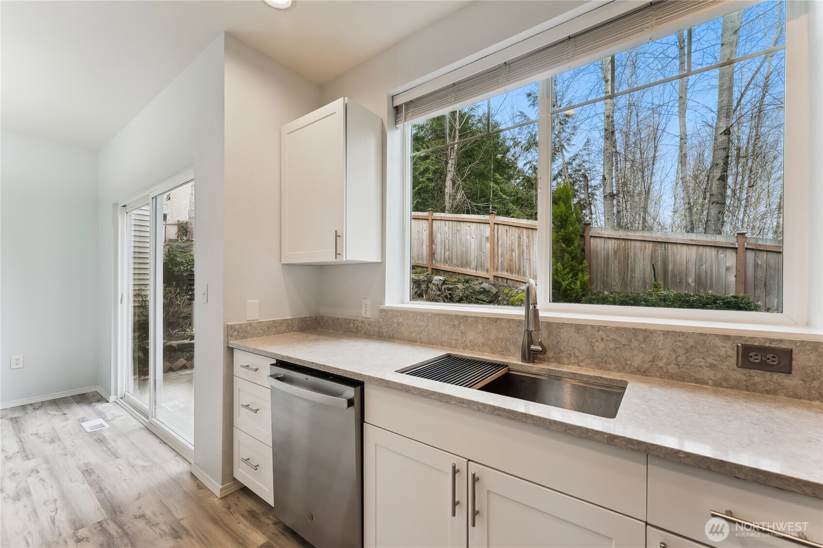 405 South 47th Street, Unit 405 Renton, WA 98055 - Photo 12 of 30 a kitchen with a sink and large window