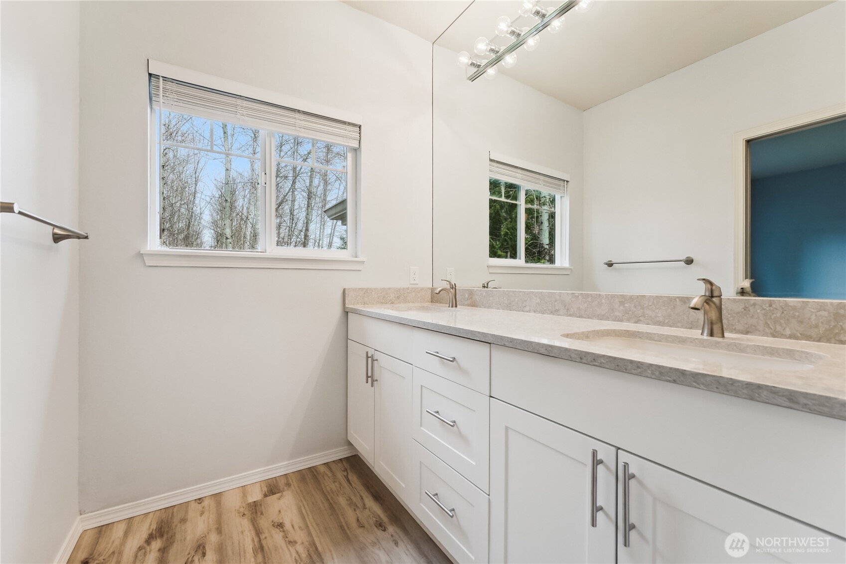 405 South 47th Street, Unit 405 Renton, WA 98055 - Photo 20 of 30 a bathroom with a granite countertop sink mirror and window