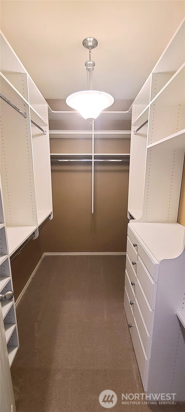 405 South 47th Street, Unit 405 Renton, WA 98055 - Photo 22 of 30 a view of a room with racks on the wall