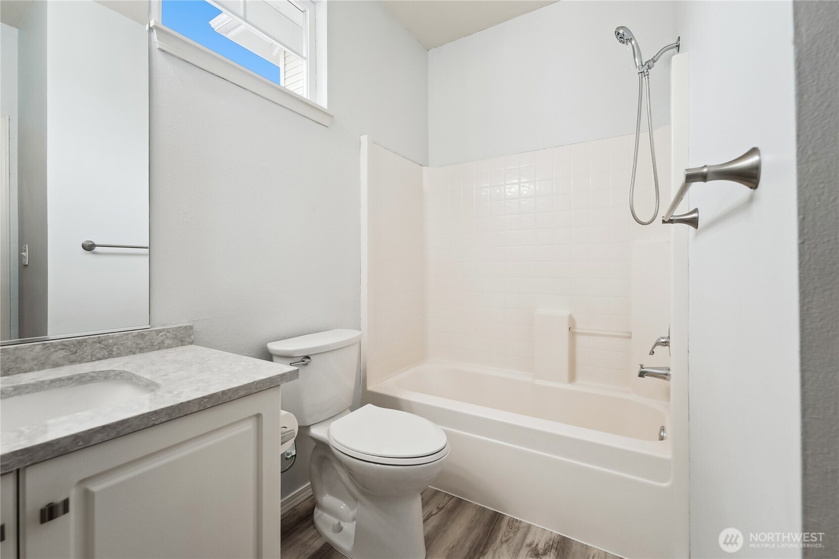 405 South 47th Street, Unit 405 Renton, WA 98055 - Photo 26 of 30 a bathroom with a granite countertop sink a toilet and shower