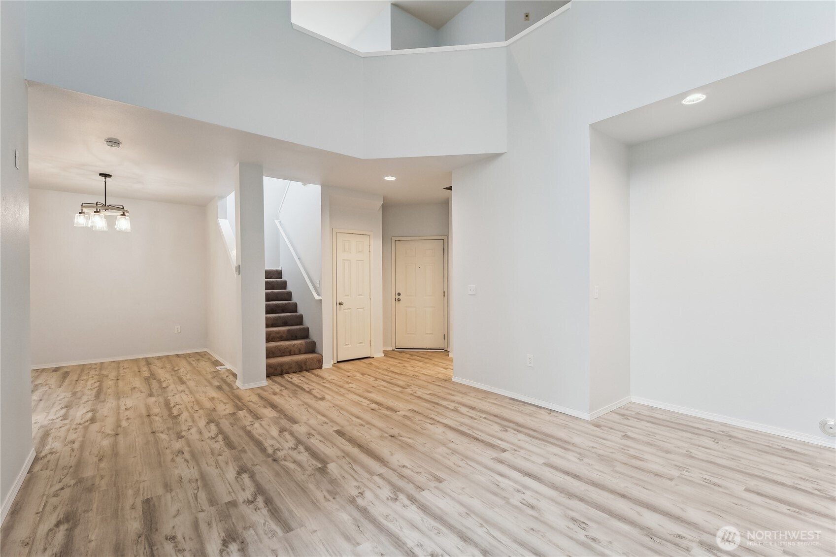 405 South 47th Street, Unit 405 Renton, WA 98055 - Photo 5 of 30 wooden floor in an empty room with a window