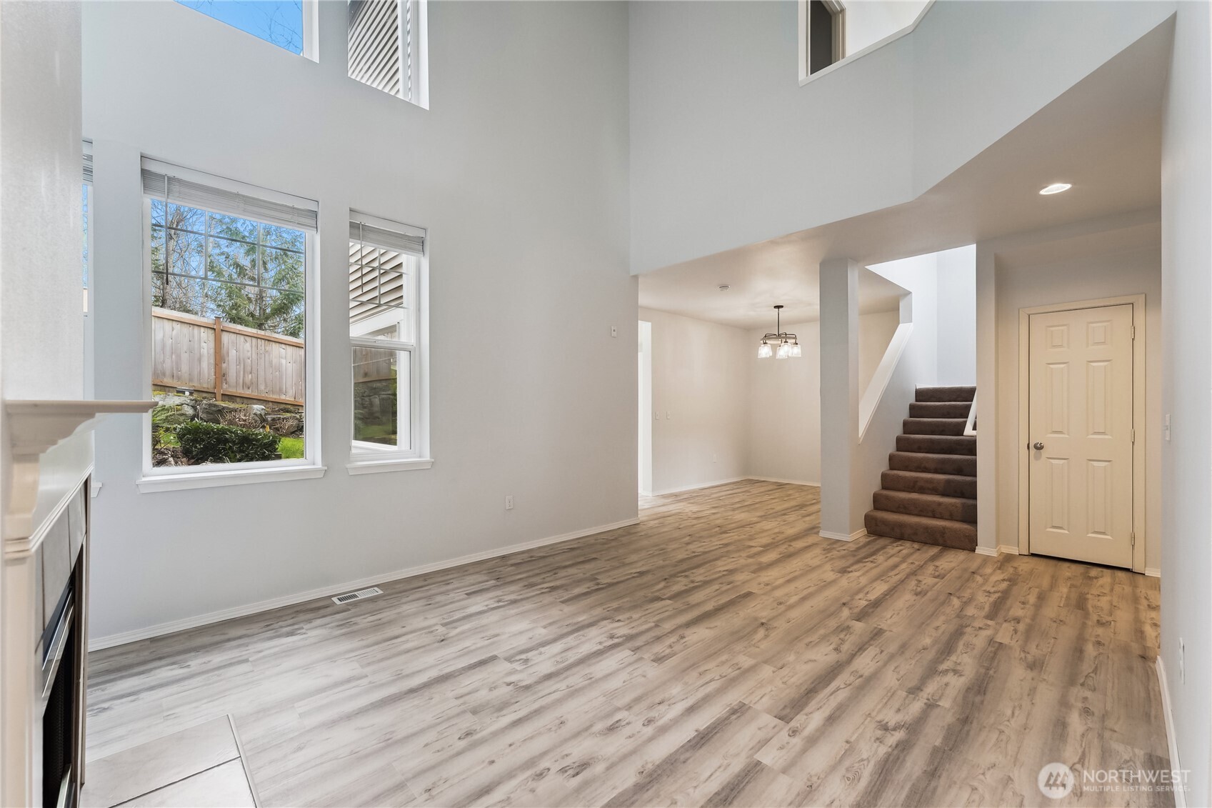 405 South 47th Street, Unit 405 Renton, WA 98055 - Photo 6 of 30 a view of a livingroom with wooden floor and stairs