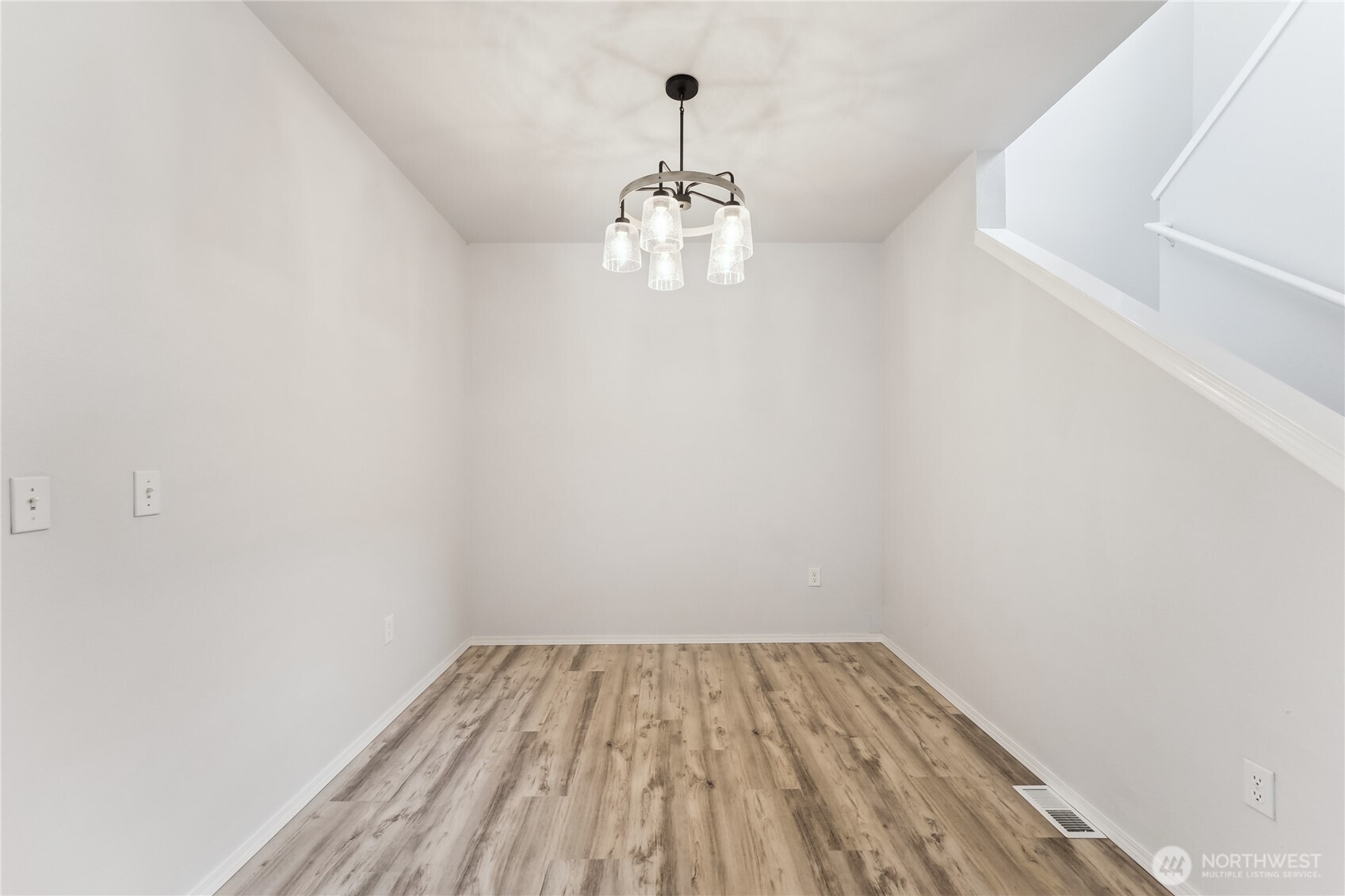 405 South 47th Street, Unit 405 Renton, WA 98055 - Photo 7 of 30 a view of empty room with wooden floor