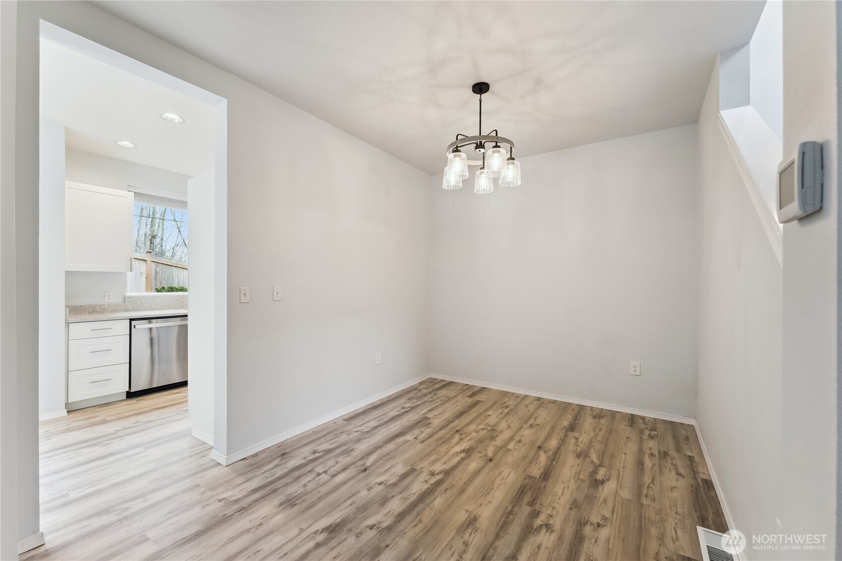 405 South 47th Street, Unit 405 Renton, WA 98055 - Photo 8 of 30 a view of empty room with wooden floor