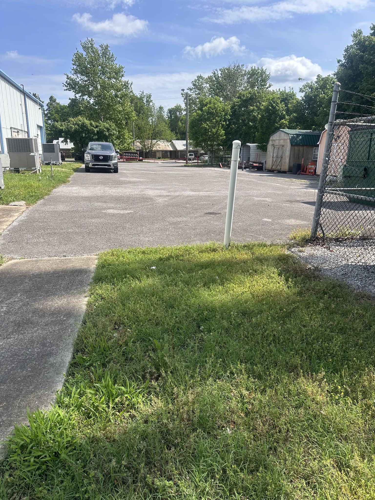 1124 Old Lascassas Road Murfreesboro, TN 37130 - Photo 5 of 6 a yellow house with trees in front of it