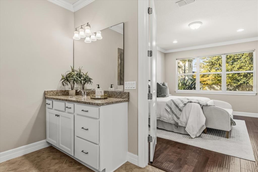 10713 BERRY CREEK Road Orlando, FL 32836 - Photo 17 of 60 a bathroom with a double vanity sink and a mirror