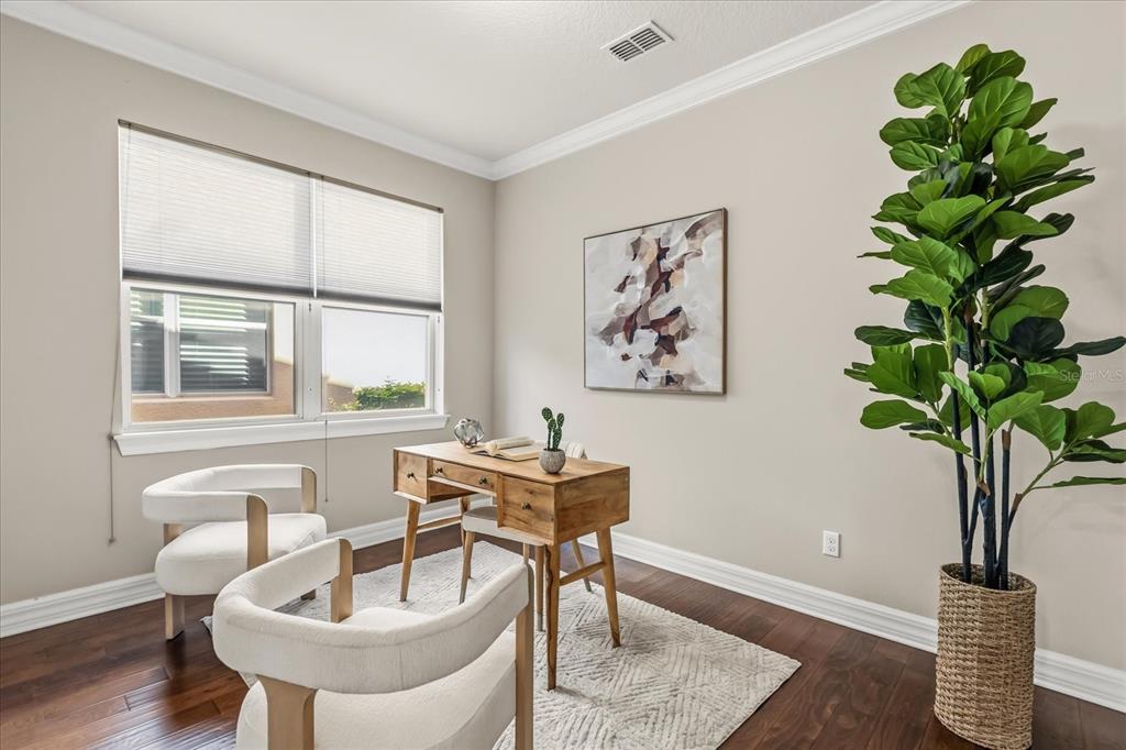10713 BERRY CREEK Road Orlando, FL 32836 - Photo 20 of 60 a dining room with furniture and a potted plant
