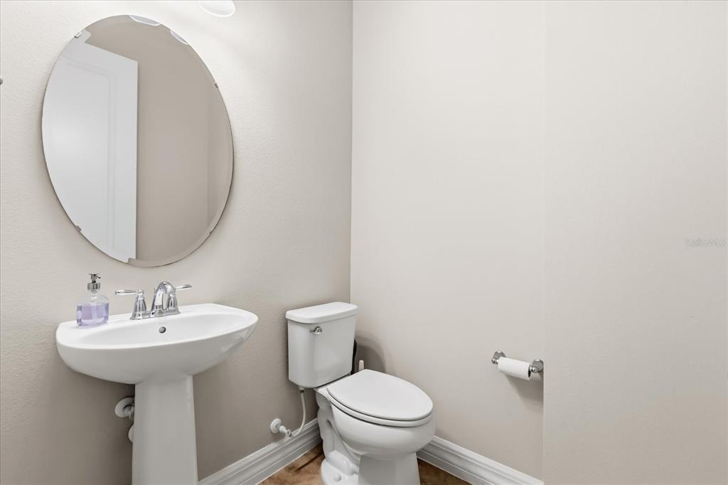 10713 BERRY CREEK Road Orlando, FL 32836 - Photo 32 of 59 a bathroom with a sink and a mirror