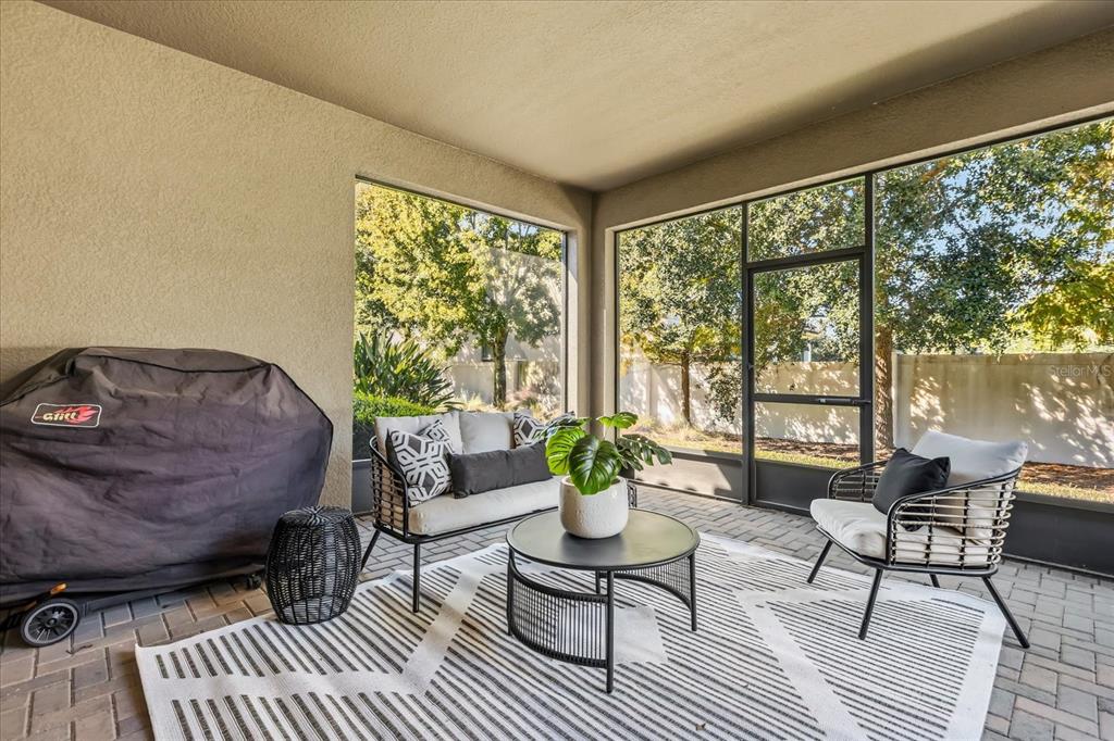 10713 BERRY CREEK Road Orlando, FL 32836 - Photo 35 of 60 a living room with furniture and a large window