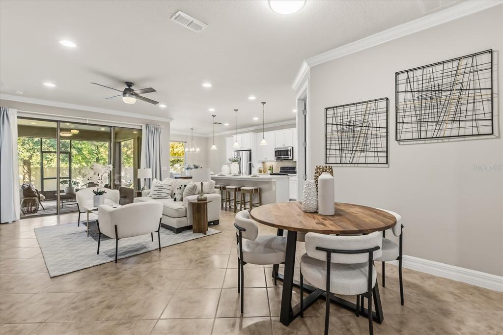 10713 BERRY CREEK Road Orlando, FL 32836 - Photo 4 of 60 a dining room with furniture and window