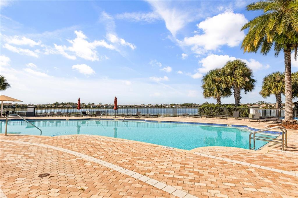 10713 BERRY CREEK Road Orlando, FL 32836 - Photo 41 of 59 a view of a swimming pool and a lake view