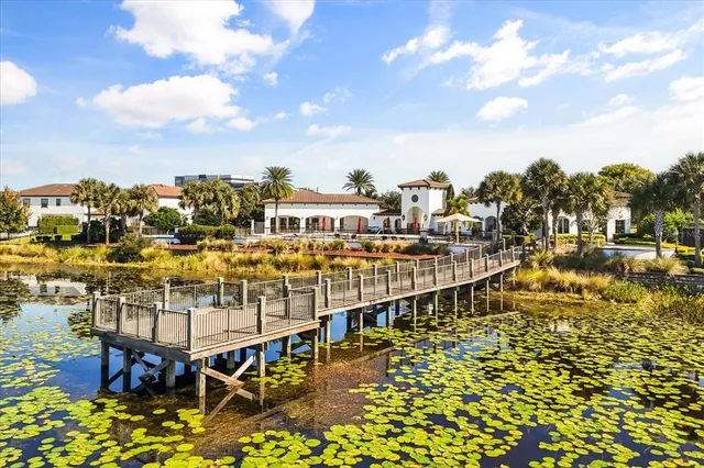 an aerial view of residential building and lake