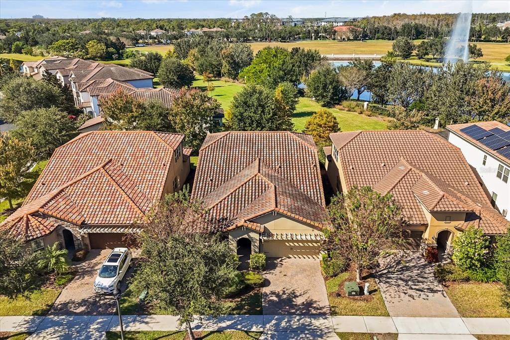 10713 BERRY CREEK Road Orlando, FL 32836 - Photo 52 of 60 an aerial view of residential houses with outdoor space and river