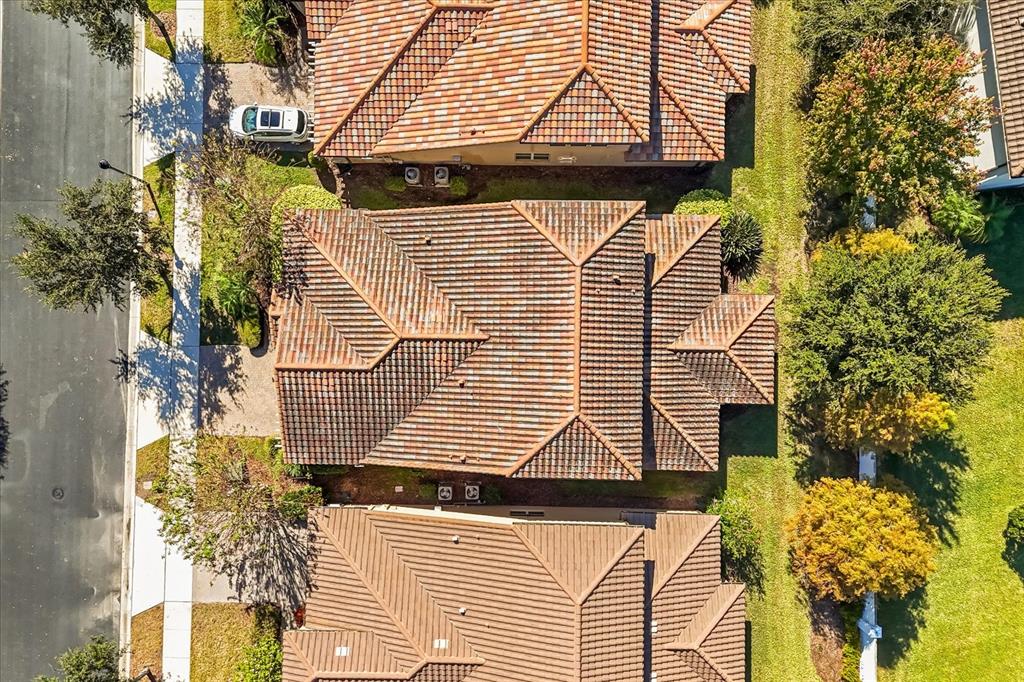 10713 BERRY CREEK Road Orlando, FL 32836 - Photo 53 of 60 a yellow building with trees in front of it