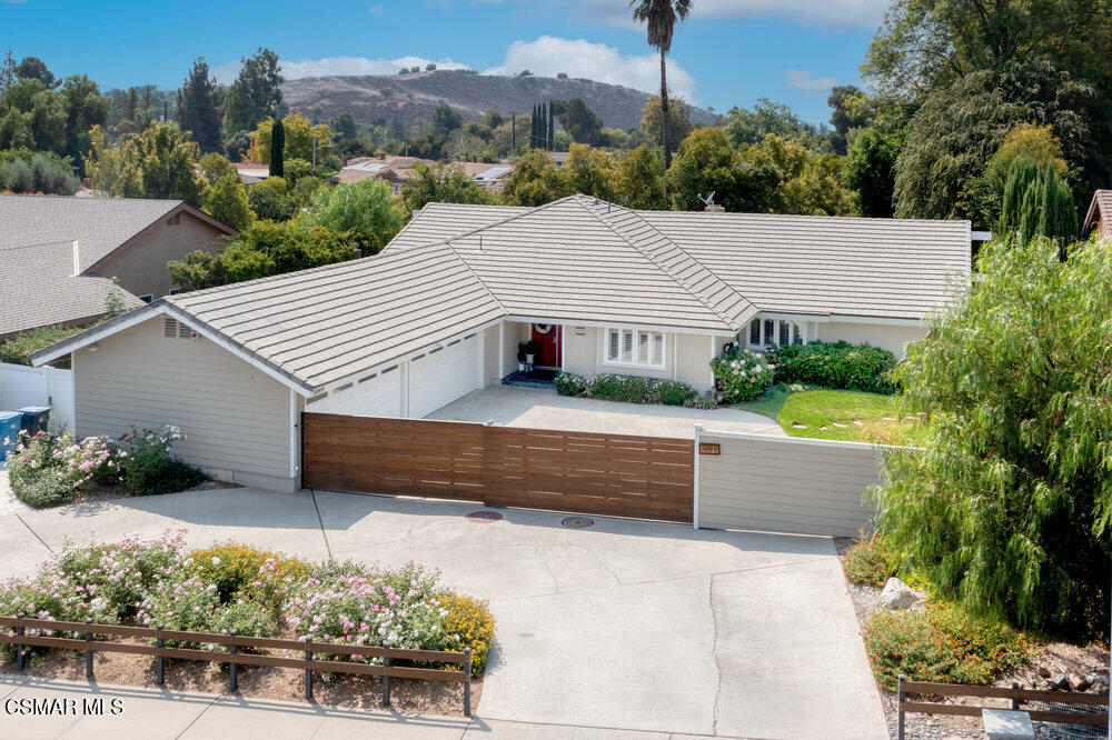 1999 Erbes Road Thousand Oaks, CA 91362 - Photo 1 of 55 a view of a house with a yard and a wooden bench