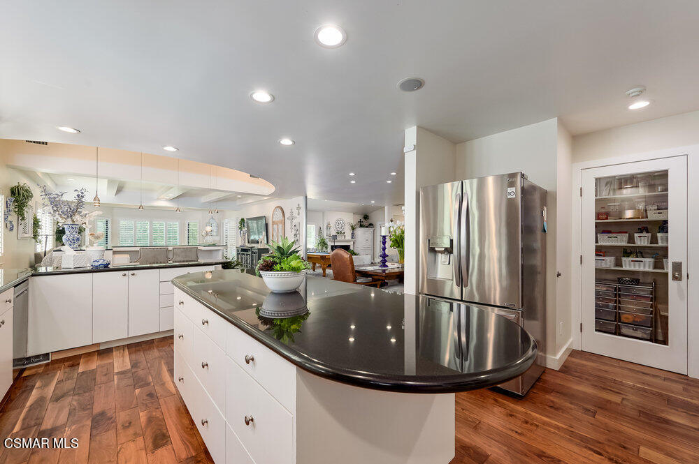 1999 Erbes Road Thousand Oaks, CA 91362 - Photo 14 of 55 a kitchen with stainless steel appliances granite countertop a sink refrigerator and cabinets