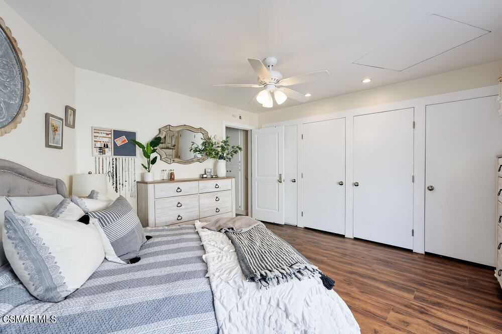 1999 Erbes Road Thousand Oaks, CA 91362 - Photo 39 of 55 a bedroom with a bed and a chandelier