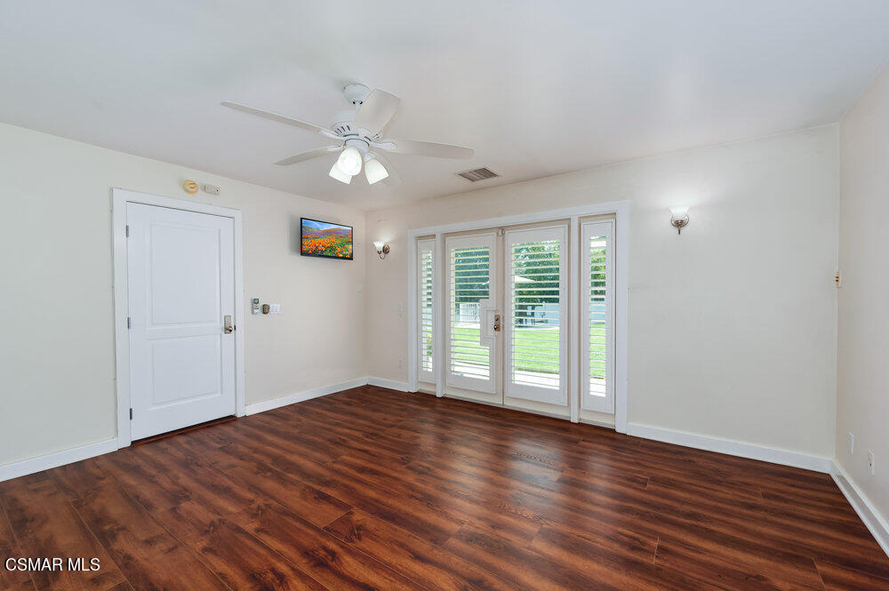 1999 Erbes Road Thousand Oaks, CA 91362 - Photo 41 of 55 a view of an empty room with wooden floor and a window