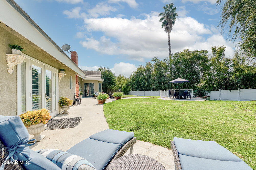 1999 Erbes Road Thousand Oaks, CA 91362 - Photo 48 of 55 a view of a backyard with couches plants and large trees