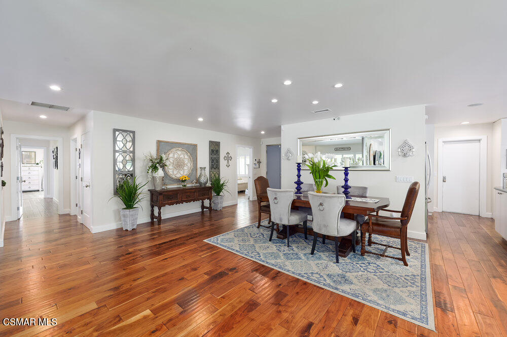 1999 Erbes Road Thousand Oaks, CA 91362 - Photo 7 of 55 a living room with furniture a wooden floor and a dining table