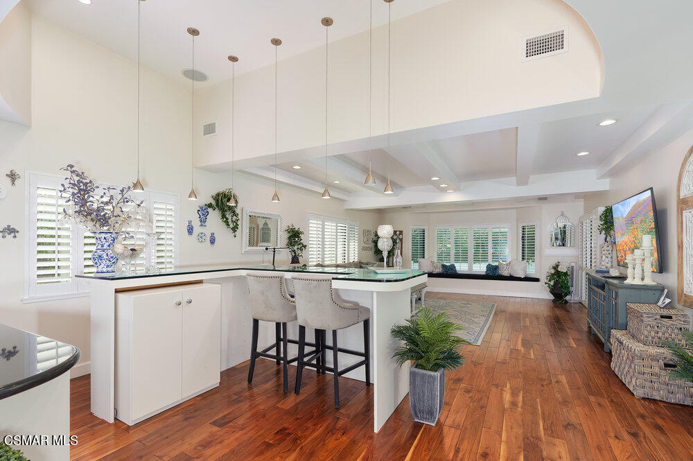 1999 Erbes Road Thousand Oaks, CA 91362 - Photo 9 of 55 a kitchen with stainless steel appliances a table and chairs in it