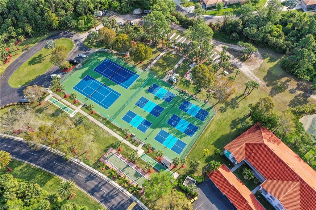 249 Gabriel Circle, Unit 12 Naples, FL 34104 - Photo 39 of 40 a view of a yard with an outdoor space