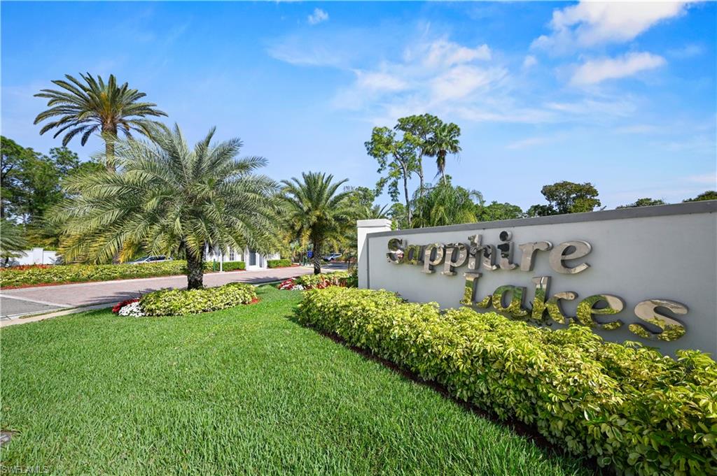 249 Gabriel Circle, Unit 12 Naples, FL 34104 - Photo 40 of 40 a view of a house with a garden