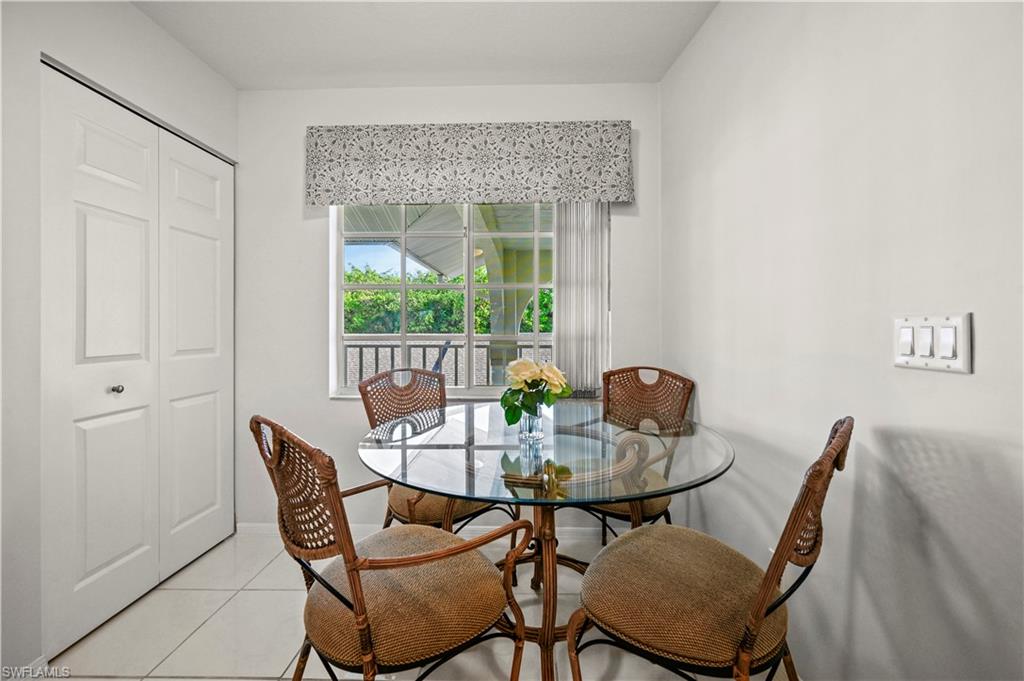 249 Gabriel Circle, Unit 12 Naples, FL 34104 - Photo 9 of 40 a view of a dining room with furniture window and outside view