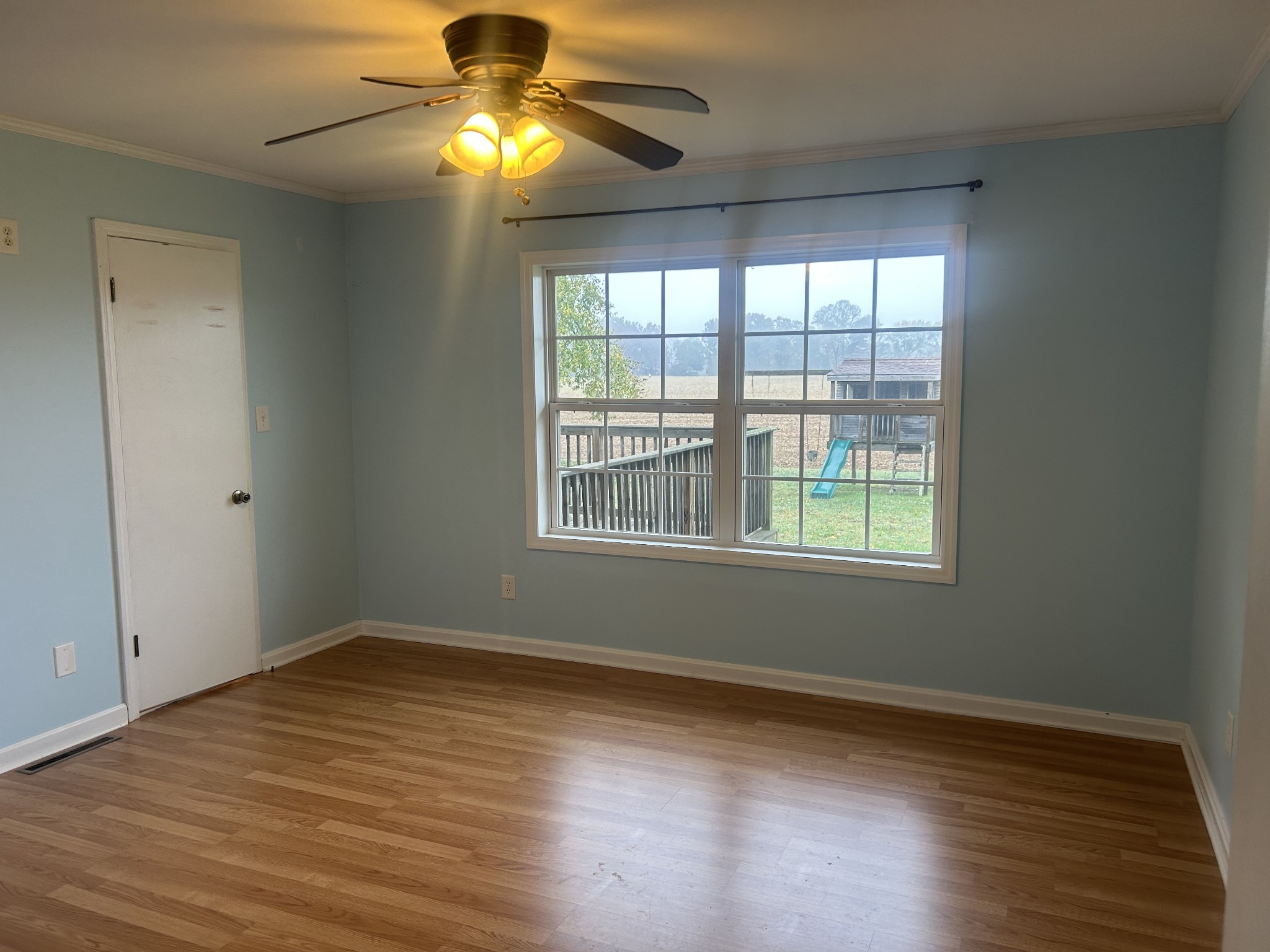489 Lone Star Road Lawrenceburg, TN 38464 - Photo 17 of 22 a view of empty room with wooden floor and fan
