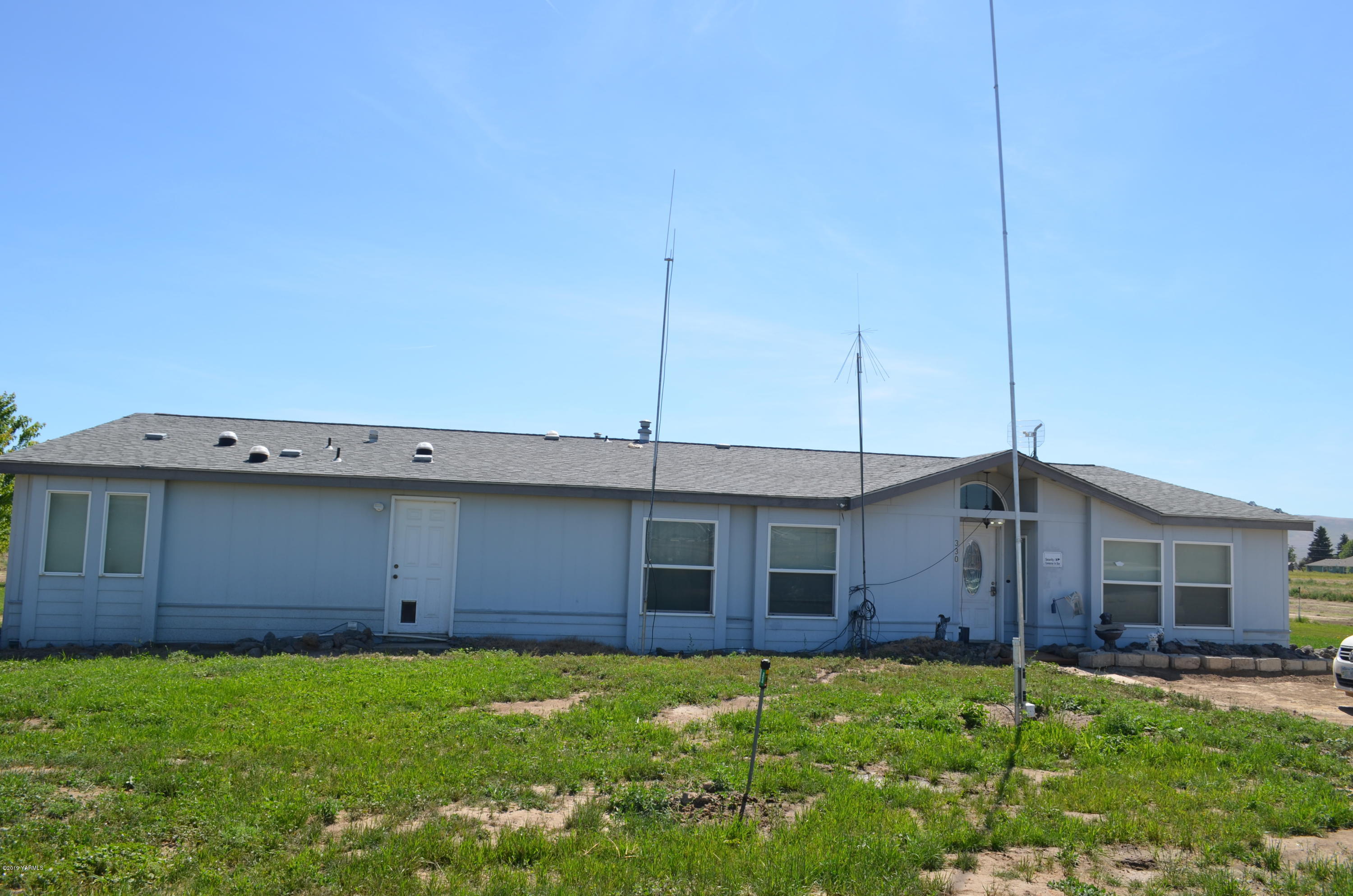 330 Gulden Road Mabton, WA 98935 - Photo 8 of 48 a view of a house with a backyard
