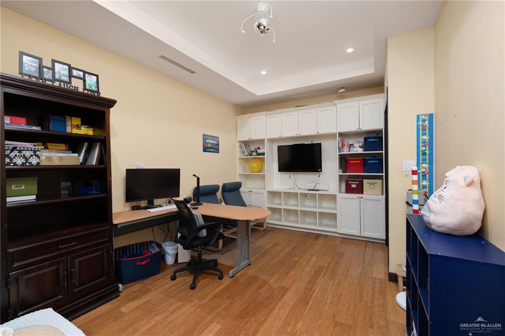 809 Rio Grande Drive Mission, TX 78572 - Photo 25 of 43 a view of a livingroom with workspace and a flat screen tv