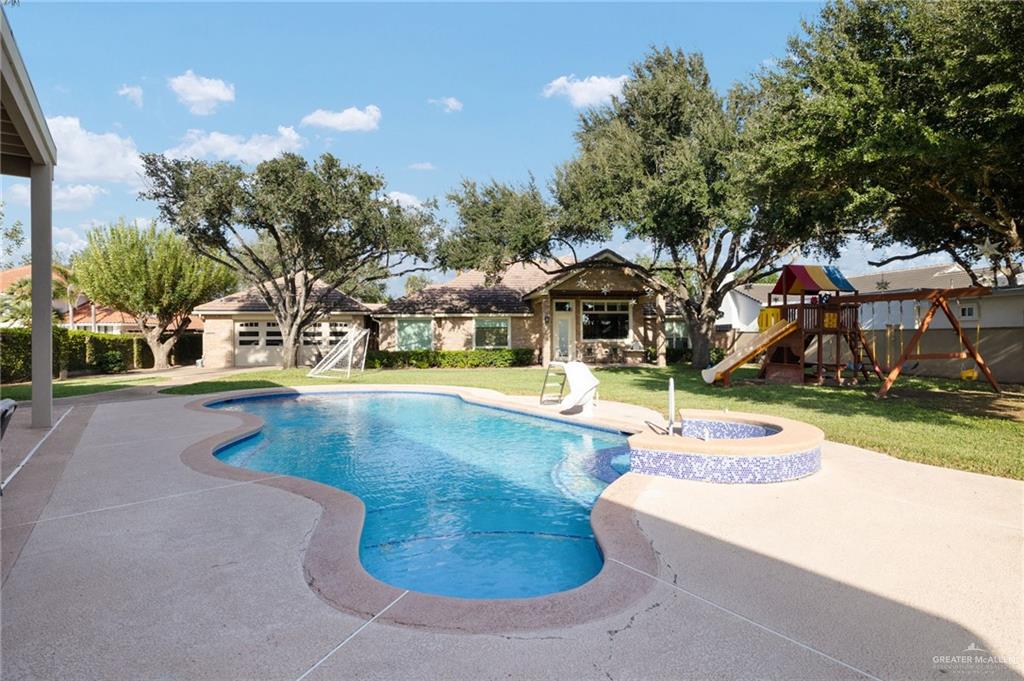 809 Rio Grande Drive Mission, TX 78572 - Photo 28 of 43 a view of a swimming pool with an outdoor space and seating area