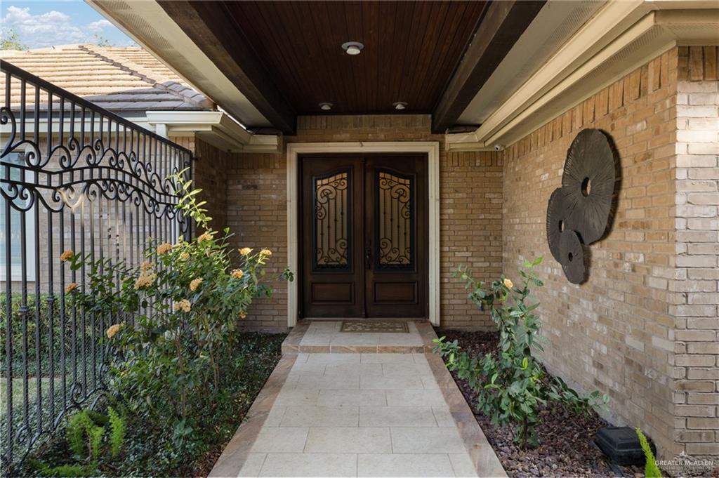 809 Rio Grande Drive Mission, TX 78572 - Photo 3 of 43 a front view of a house with a garden