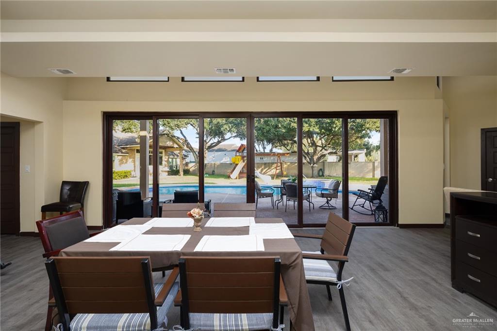809 Rio Grande Drive Mission, TX 78572 - Photo 37 of 43 a view of a dining room with furniture window and wooden floor