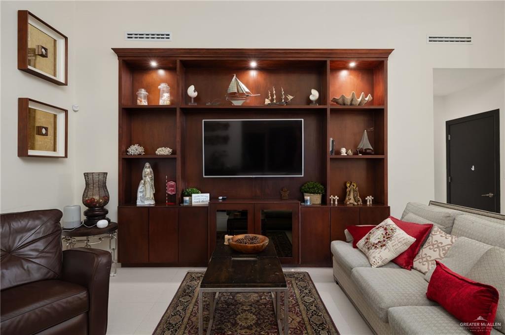 809 Rio Grande Drive Mission, TX 78572 - Photo 7 of 43 a living room with furniture and a flat screen tv